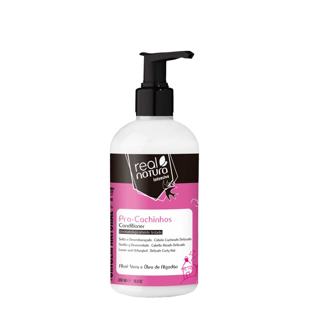 Real Natura Pro-Cachinhos condicionador sem sal 300ml Frasco branco com doseador preto de condicionador Real Natura Pro-Cachinhos com rótulo rosa
