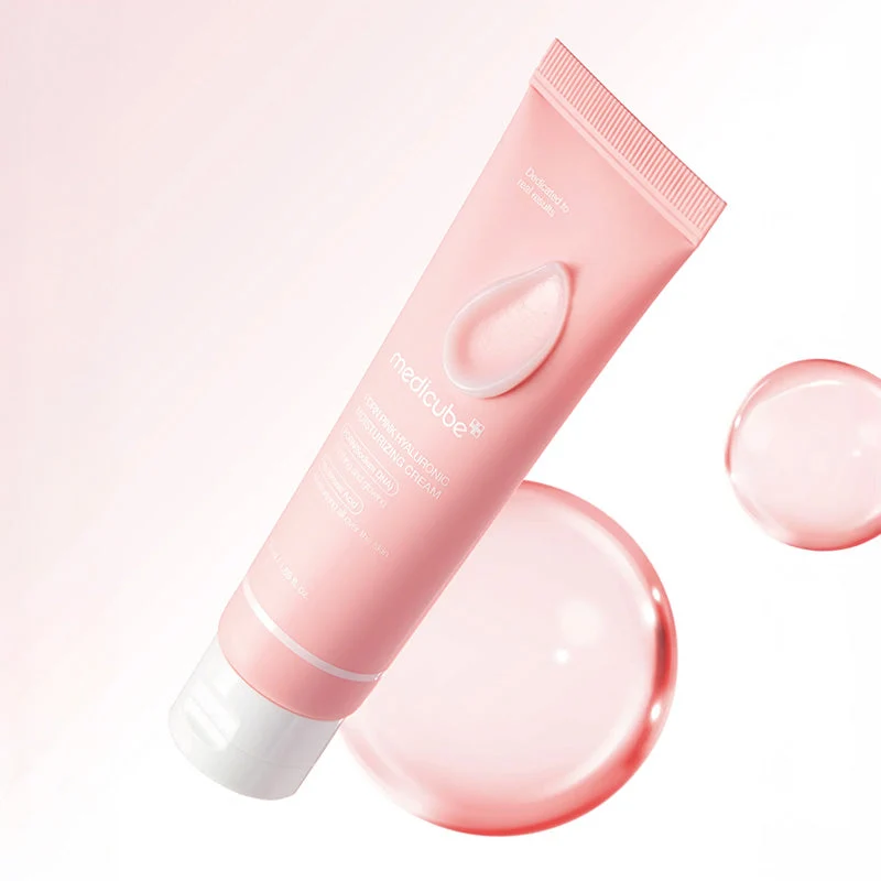 Medicube Pdrn Pink Hyaluronic Moisturizing Cream 50ml Creme hidratante para rosto em tubo rosa com texto branco e fundo rosa com gotas