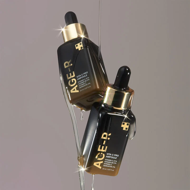 Medicube Age-R Vita C Pro Ampoule 20ml - Skin Care Serum Frascos pretos e dourados com conta-gotas e líquido escorrendo