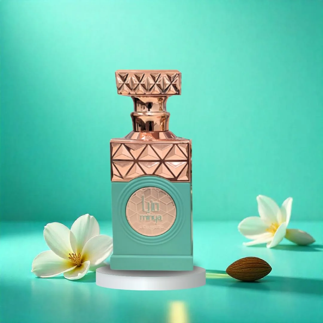 MINYA Paris corner perfume UNISEX 100ml Frasco de perfume verde e dourado com flores e amêndoa sobre fundo azul