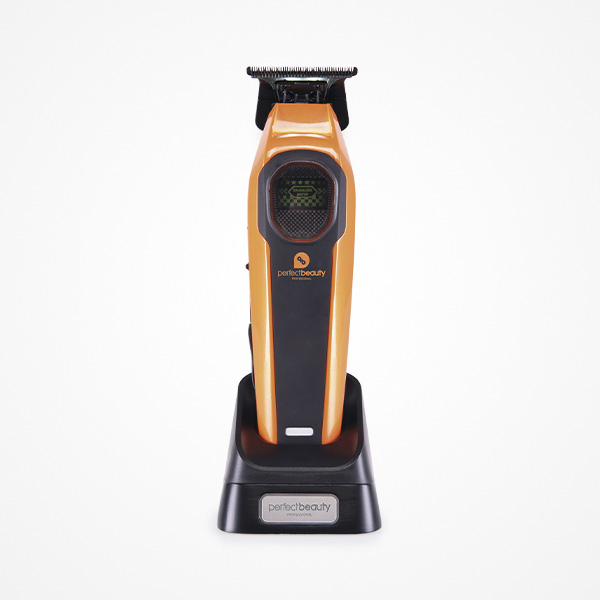 Perfect Beauty Orbis Beam Trimmer Aparelho de cortar cabelo elétrico laranja e preto numa base de carregamento preta, fundo branco.