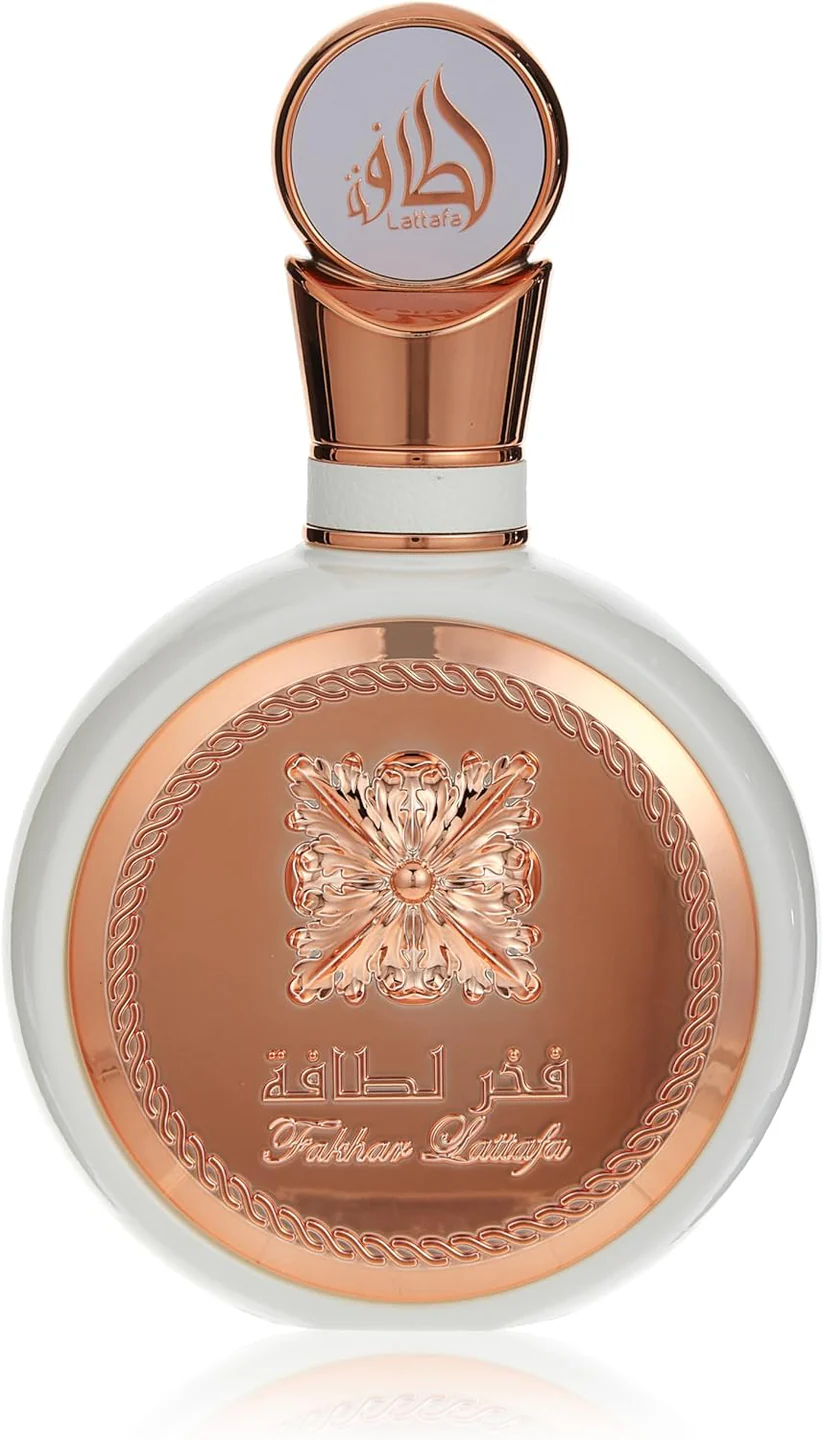 Fakhar Woman Pride Rose Lattafa 100ml (Original) frasco de perfume redondo com tampa dourada e branca com texto e decoração metálica
