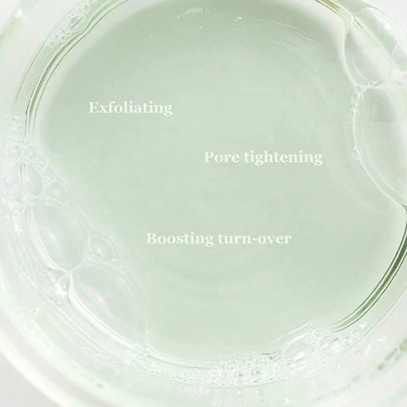 Beauty Of Joseon Green Plum Refreshing Toner Aha + Bha - 150ml Líquido transparente com bolhas num recipiente de vidro, texto sobreposto relacionado a cuidado da pele