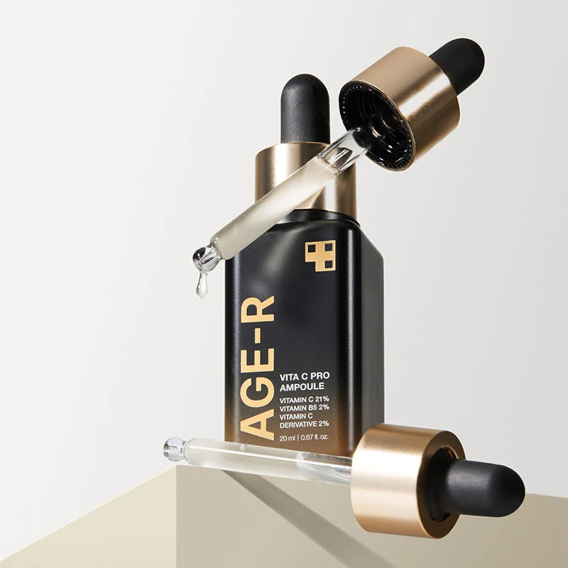 Medicube Age-R Vita C Pro Ampoule 20ml - Skin Care Serum Frasco preto com conta-gotas e texto dourado em fundo branco