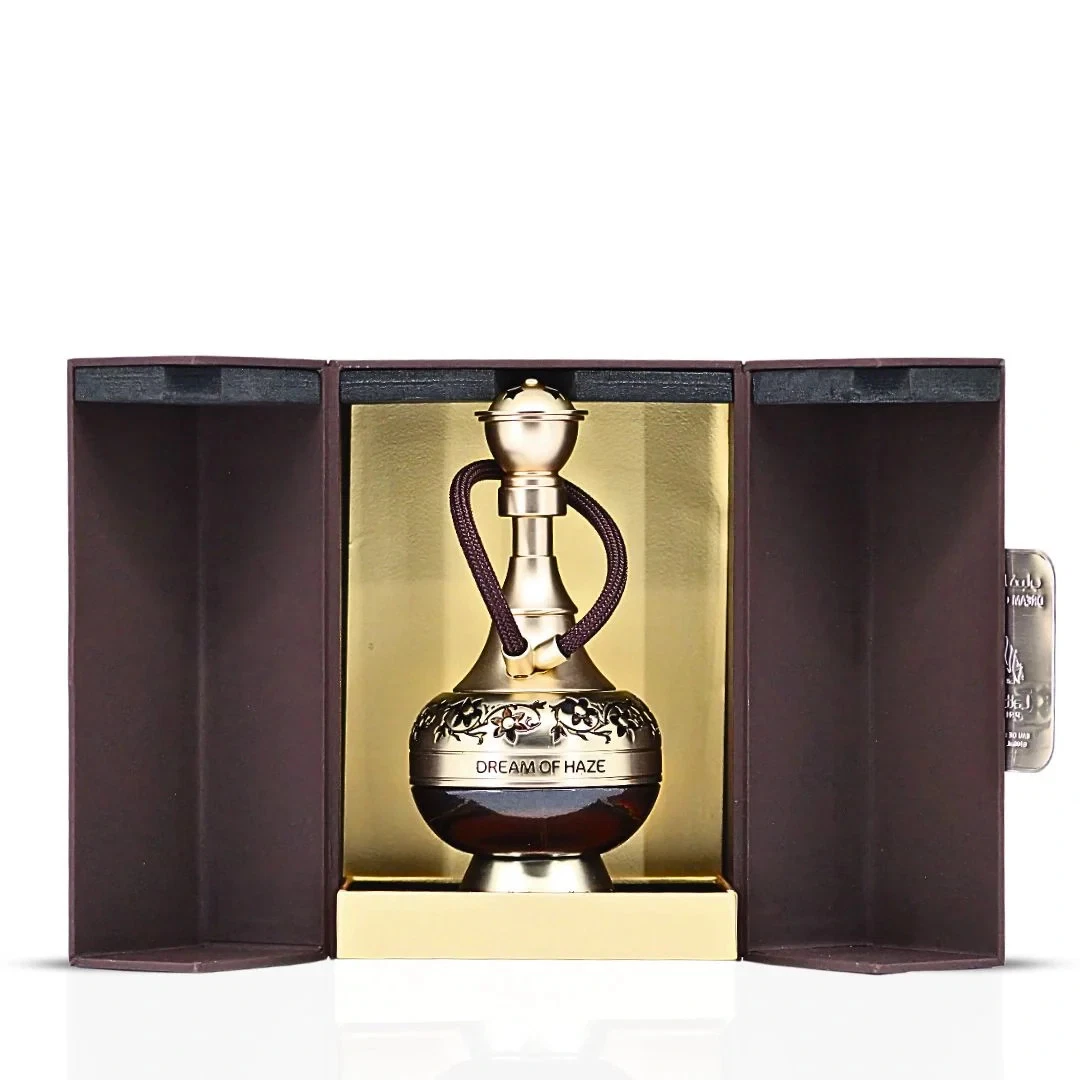 Dream Of Haze Lattafa Perfumes Compartilhável 100 ml Frasco de perfume dourado com alça em caixa aberta