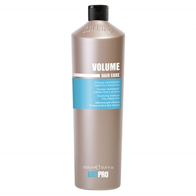 Frasco alto cinzento fosco de champô KayPro Volume Hair Care com rótulo azul