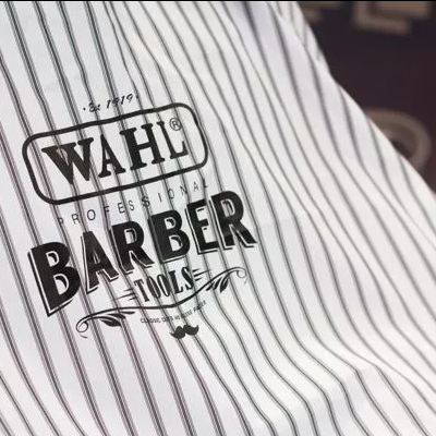 Avental de barbeiro riscado com texto WAHL PROFESSIONAL BARBER TOOLS