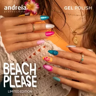 Unhas decoradas com esmalte gel de várias cores em mãos femininas com acessórios dourados
