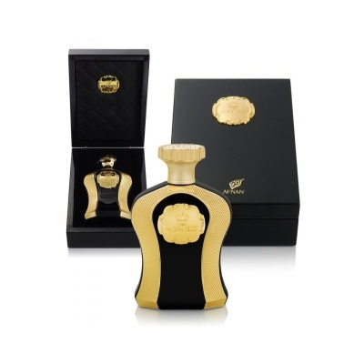 Frasco de perfume preto e dourado com caixa preta