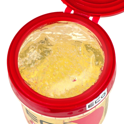 Frasco vermelho aberto com gel dourado translúcido e bolhas