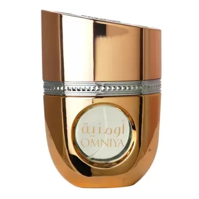 Frasco dourado metálico de perfume OMNIYA com detalhe prateado ao centro