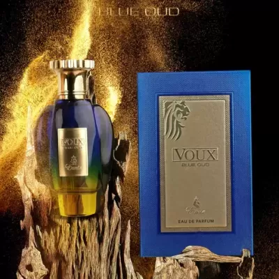 Frasco de perfume azul e amarelo com tampa dourada ao lado de caixa azul com etiqueta dourada