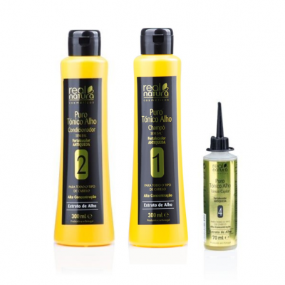 Três frascos de produtos capilares Real Natura amarelo e transparente com rótulos pretos e verdes.