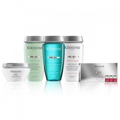 Conjunto de produtos Kérastase Spécifique com embalagens brancas, verdes e azuis