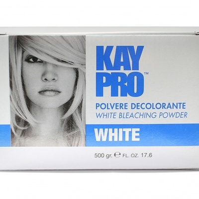 Caixa branca e azul de pó descolorante Kay Pro com imagem de mulher loira