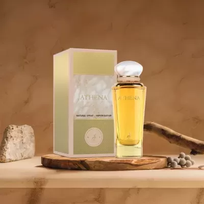 Perfume ATHENA em frasco de vidro amarelo com caixa branca e verde