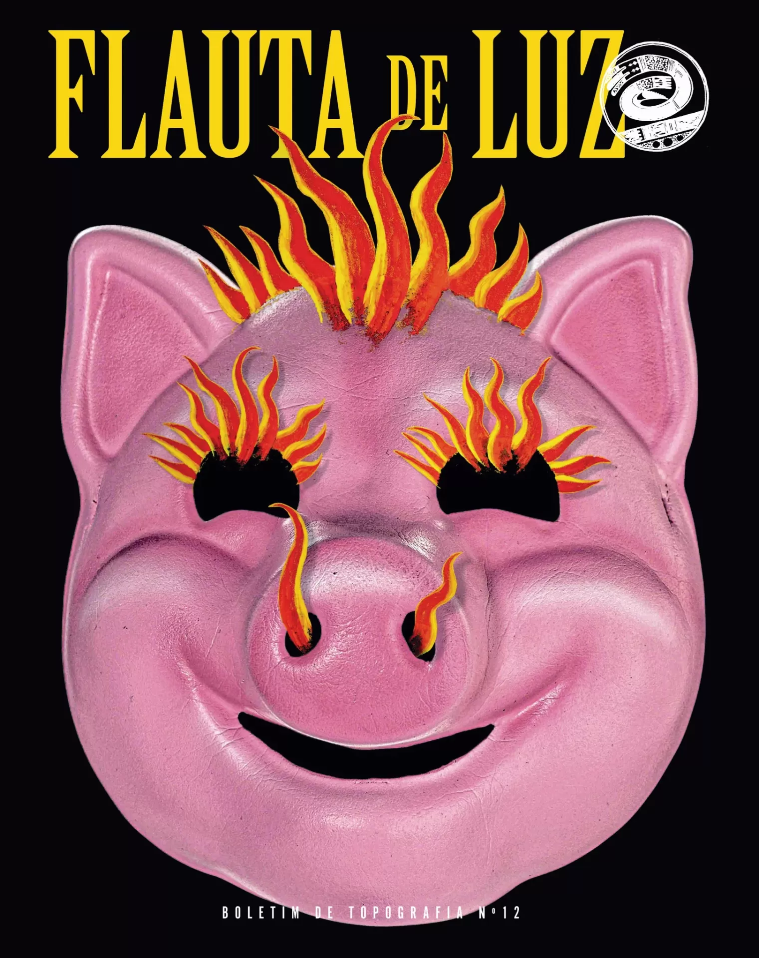 Flauta de Luz nº12 Máscara rosa de porco com chamas sobre fundo preto e texto