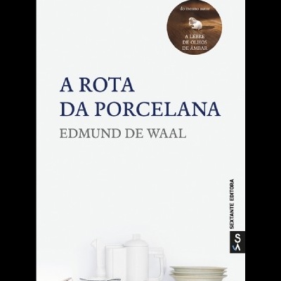Capa do livro A ROTA DA PORCELANA de Edmond de Waal com selo do autor e imagem de louça