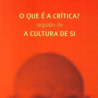 Capa de livro com título e autor em fundo laranja e cinza, imagem pixelada da cabeça de um homem.