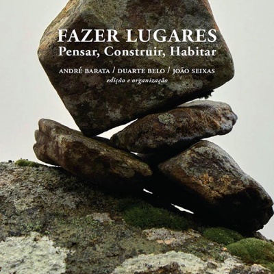 Livro com capa de pedras empilhadas e texto do título em branco