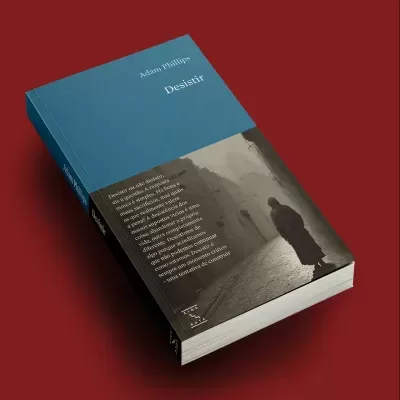 Livro 'Desistir' de Adam Phillips com capa azul e castanha e imagem em sépia de rua antiga.