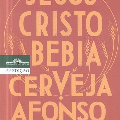 Capa de livro cor de tijolo com texto amarelo e selo da Companhia das Letras