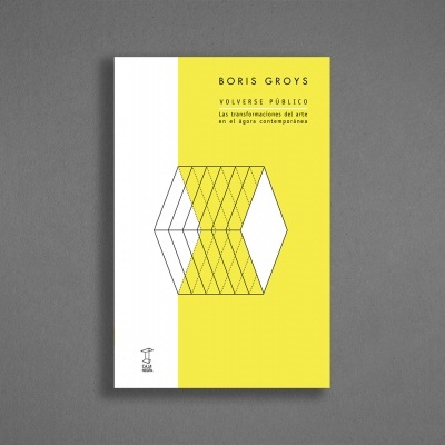 Livro com capa branca e amarela com texto e padrão geométrico.