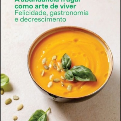 Capa de livro com tigela de sopa laranja decorada com manjericão e sementes