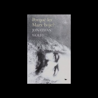 Capa de livro cinzenta com imagem do rosto de Karl Marx e texto do título e autor