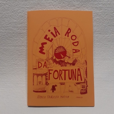 Livro com capa laranja com título em vermelho e ilustração de roda-gigante.