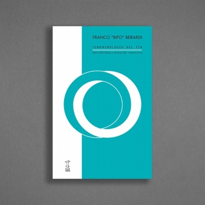 Livro com capa azul turquesa e branco com círculos e texto em azul claro