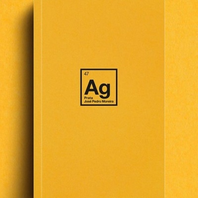 Livro amarelo com símbolo químico Ag e texto José Pedro Moreira