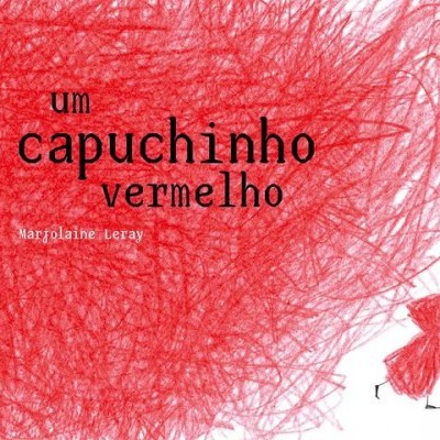 Capa de livro com título 'um capuchinho vermelho' e figura vermelha com capuz
