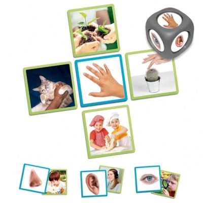 Dado e imagens com temas de mãos, sentidos e crianças