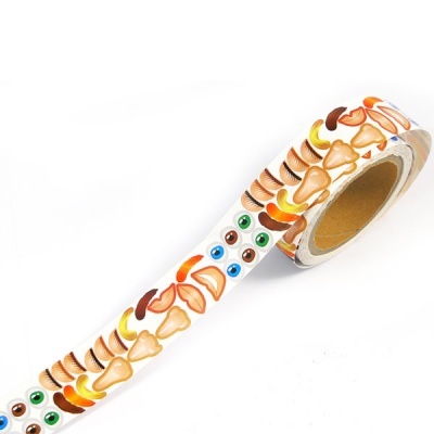 Rolo de fita adesiva decorativa com padrão colorido de olhos e formas geométricas