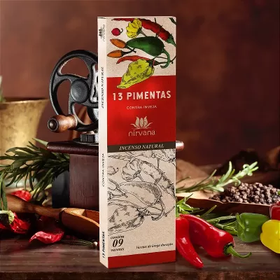 Caixa de incenso '13 PIMENTAS' da marca Nirvana com ilustrações de pimentos e pimentos frescos ao fundo