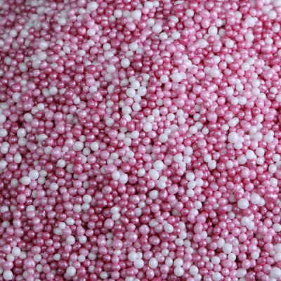 Confeitos redondos rosa e branco para decoração de bolos