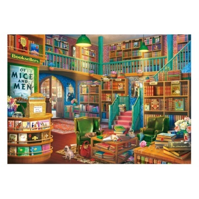 Livraria interior com estantes de livros e cadeiras verdes