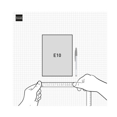 Caderno cinza E10, caneta e régua em fundo quadriculado