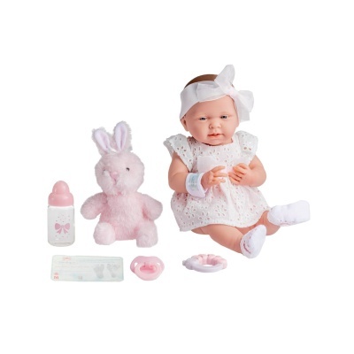 Boneca bebé com acessórios rosas e branco sobre fundo branco