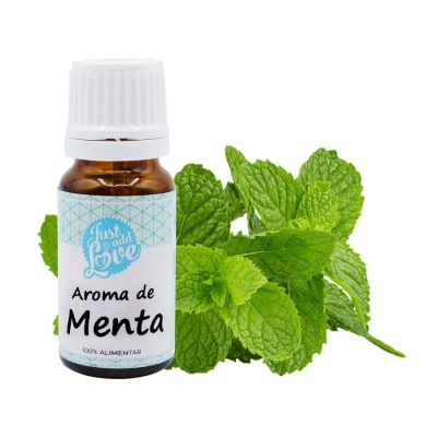 Frasco de aroma de menta com folhas de hortelã ao lado