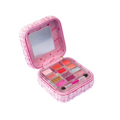 Estojo de maquilhagem rosa aberto com espelho e diversas cores de batons e sombras glitter