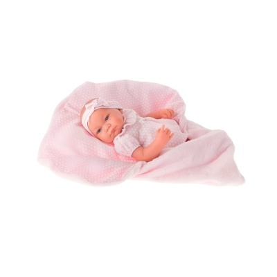 Boneca bebé deitada numa manta rosa com roupinha branca de bolinhas cor de rosa