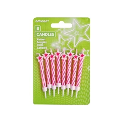 Velas cor-de-rosa com estrelas vermelhas em embalagem verde