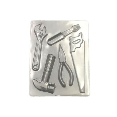 Molde de silicone transparente com formas de ferramentas diversas.