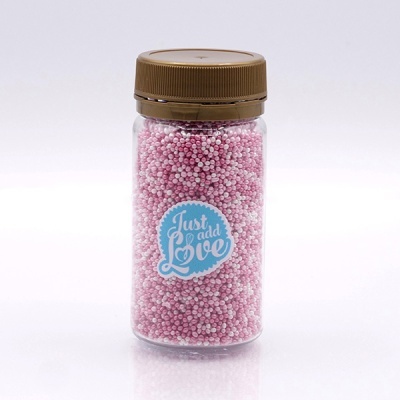 Frasco com pérolas cor-de-rosa e etiqueta 'Just add Love'