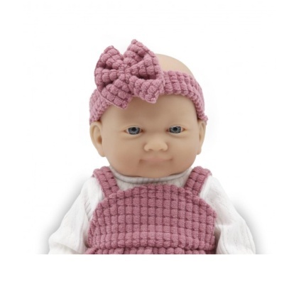 Boneca com roupa rosa texturada e faixa de cabelo com laço