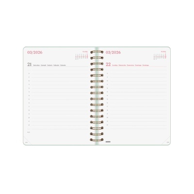 Agenda semanal aberta com espiral dourada e páginas com linhas