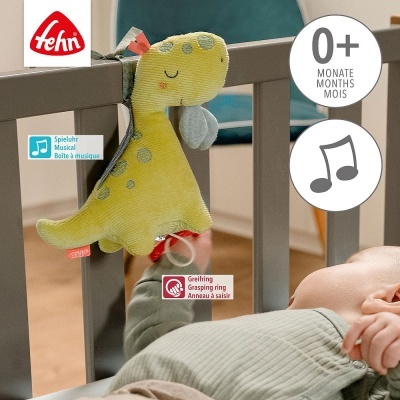 Brinquedo musical de dinossauro de pelúcia amarelo pendurado no berço cinzento