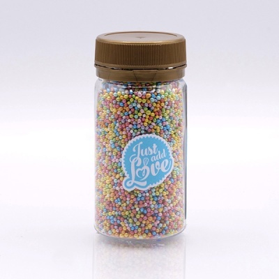 Frasco com pequenas bolinhas coloridas e tampa castanha